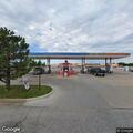 Car hits cement sign post near Murphy USA