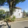 Person experiencing abdominal pain in Syosset
