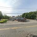 Vehicles idling at closed Triangle Pub parking lot