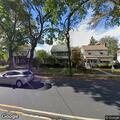 Man looking into windows on East Passaic Avenue