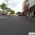 Man reportedly pins woman against store building