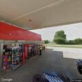 Adult female passed out inside car at gas station