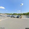 Man found slumped on bicycle in parking lot