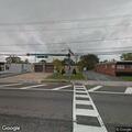 Man slumped over wheel in green sedan at firehouse