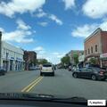 Person sleeping on sidewalk near Bloomfield Avenue