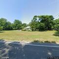 Stray dog blocking traffic on Mill Road in Yaphank