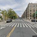 Person lying outstretched on pavement near (number withheld) St