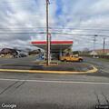 Confused female in blue truck at Exxon station