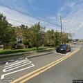 Woman blocking traffic while undressing in roadway