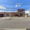 Man unconscious but breathing at business parking lot