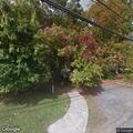 female injured hand and knee after fall outside home