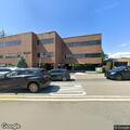 Unconscious person reported in vehicle with hazards on