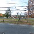 Unoccupied vehicles behind school near block party