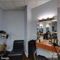Car crashes into hair salon building