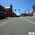 Car driving without headlights on Main Street