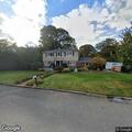 Suspicious car speeds away from Centerport home
