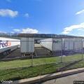 Person experiencing back pain at shipping facility
