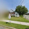 Car parked on wrong side of road on Bogert Street