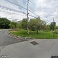 Two men argue and push each other at Avalon Way