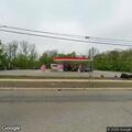 Debris causing road hazard at gas station