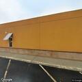 Suspicious person with luggage in parking lot