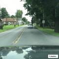 Person experiencing abdominal pain near Route 209