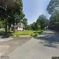 Large tree branches leaning into local roadways