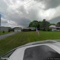 Two-car crash damages utility pole on road