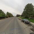 Person walking in traffic without clothes on Hanson Street