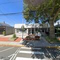 Adult female having difficulty breathing on Main Street
