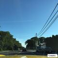 Debris casing hanging over roadway at intersection