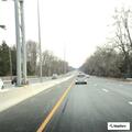 Young man hitchhiking near Russell Avenue