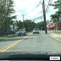 Car blocking rear driveway on Godwin Avenue