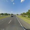 Injured deer and debris blocking roadway
