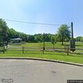 Rock from mower breaks vehicle window in park