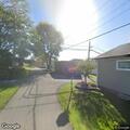 Person aged 50 experiencing breathing issues on Russell Ave