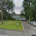 Disabled vehicle blocking driveway on Prospect Avenue