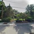 Person with abdominal pain at Saddle River hospital plaza