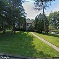Car playing loud music in driveway on Wayne Street
