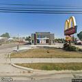 Man slumped over wheel of car at McDonald's