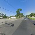 Woman walking in and out of traffic on Route 23