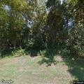 Tree limb on power line at Strawberry Lane property