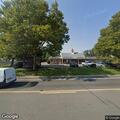 Person found lying under tree with open container