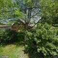 Large tree limb hanging in utility lines