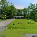Elderly woman vomiting and sweating near red oak drive