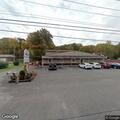 Female patient feeling faint in white car at learning center
