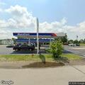 Man unresponsive in blue truck at gas station