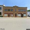 Open door at vacant building on Marble Avenue