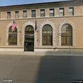 Person with head injury from past assault at police station
