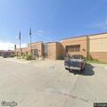 Officer transports male suspect to jail booking